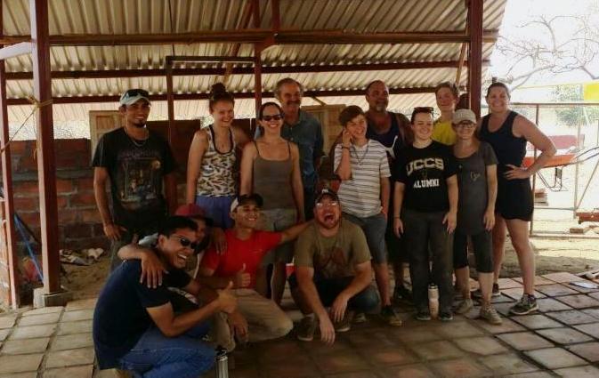 A hard-working group of volunteers that helped build the Model Farm's Learning Center.