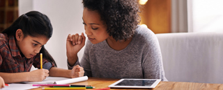 student doing school work with parent