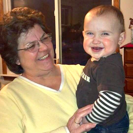 Suzanne Taylor holding her grandson Jordan with smiles all around