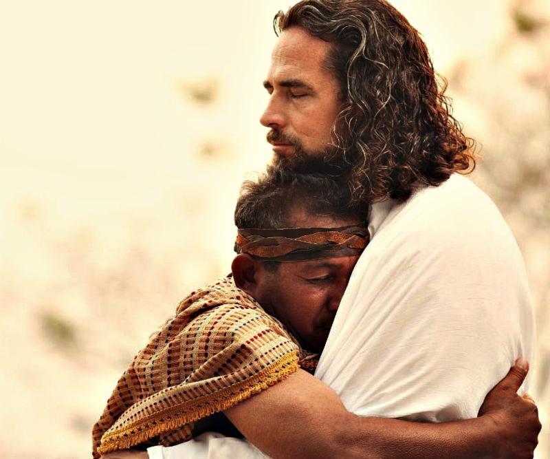 Jesus and a man embracing