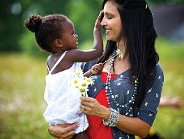 Woman holding a smiling child