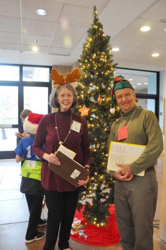 Santa's elves in front of tree