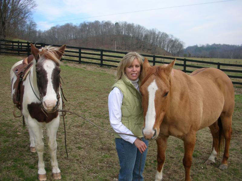 Nancy Quigley, exercise physiologist, health coach, and personal trainer, with her horses.