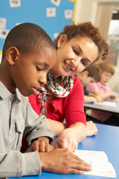 Teacher working with student