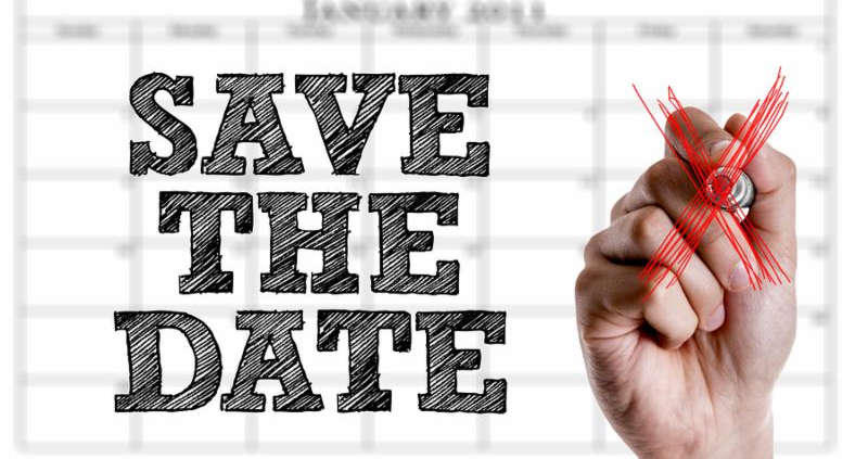Hand writing the text Save The Date