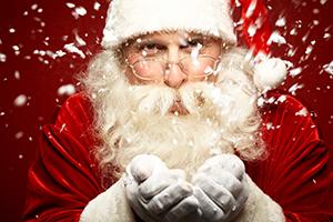 Santa blowing snow
