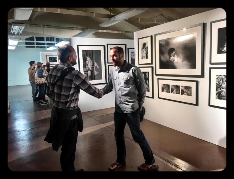 Jack Johnson (r) greeting fan at the Morrison Hotel Gallery PopUp Gallery at Monterey 50th