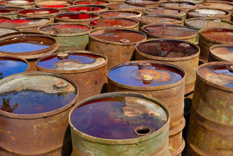 Field of hundreds used toxic rusty drums