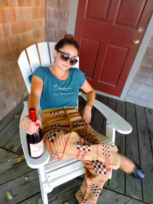 Burberry knit pant, Size S, $236; "Escape the Ordinary" Tee, Sizes XS-M, $45. Contrast trim Ballet flat, Size 8, $58. Williams-Selyem "Westside Road Neighbors" RRV Pinot Noir 2012, $115.