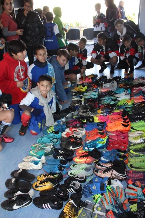 HOSF and Ohio North players distribute equipment brought from the USA