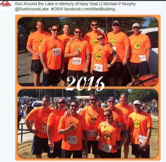 Employees in tshirts posing after a 5k