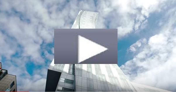 Tall building against a cloudy sky