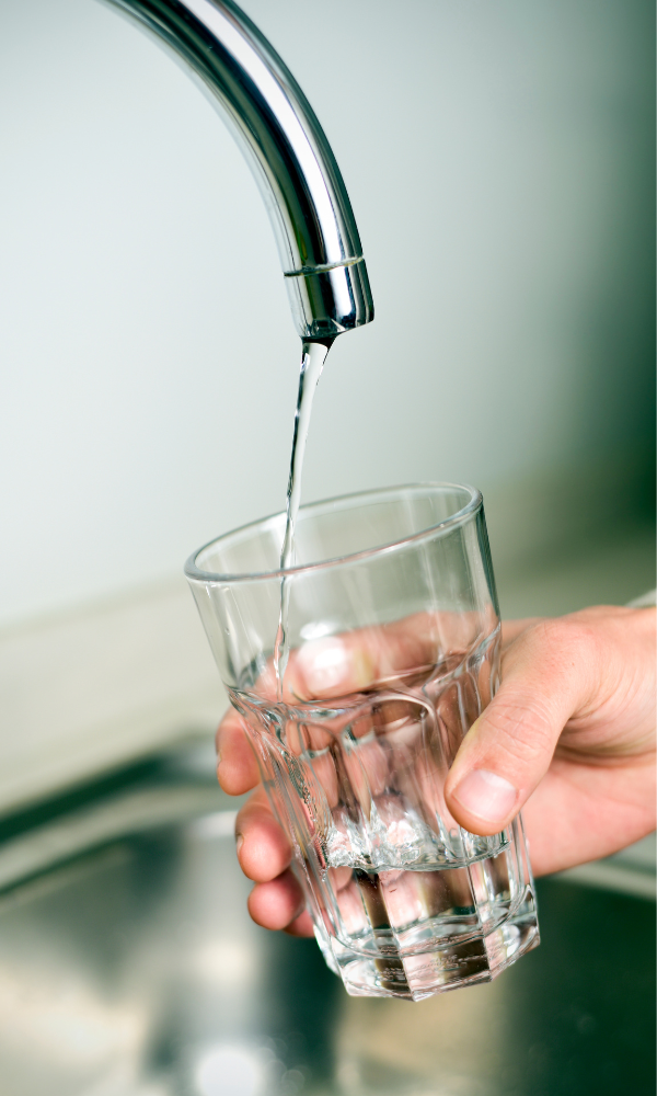 Filling a glass of water from a faucet