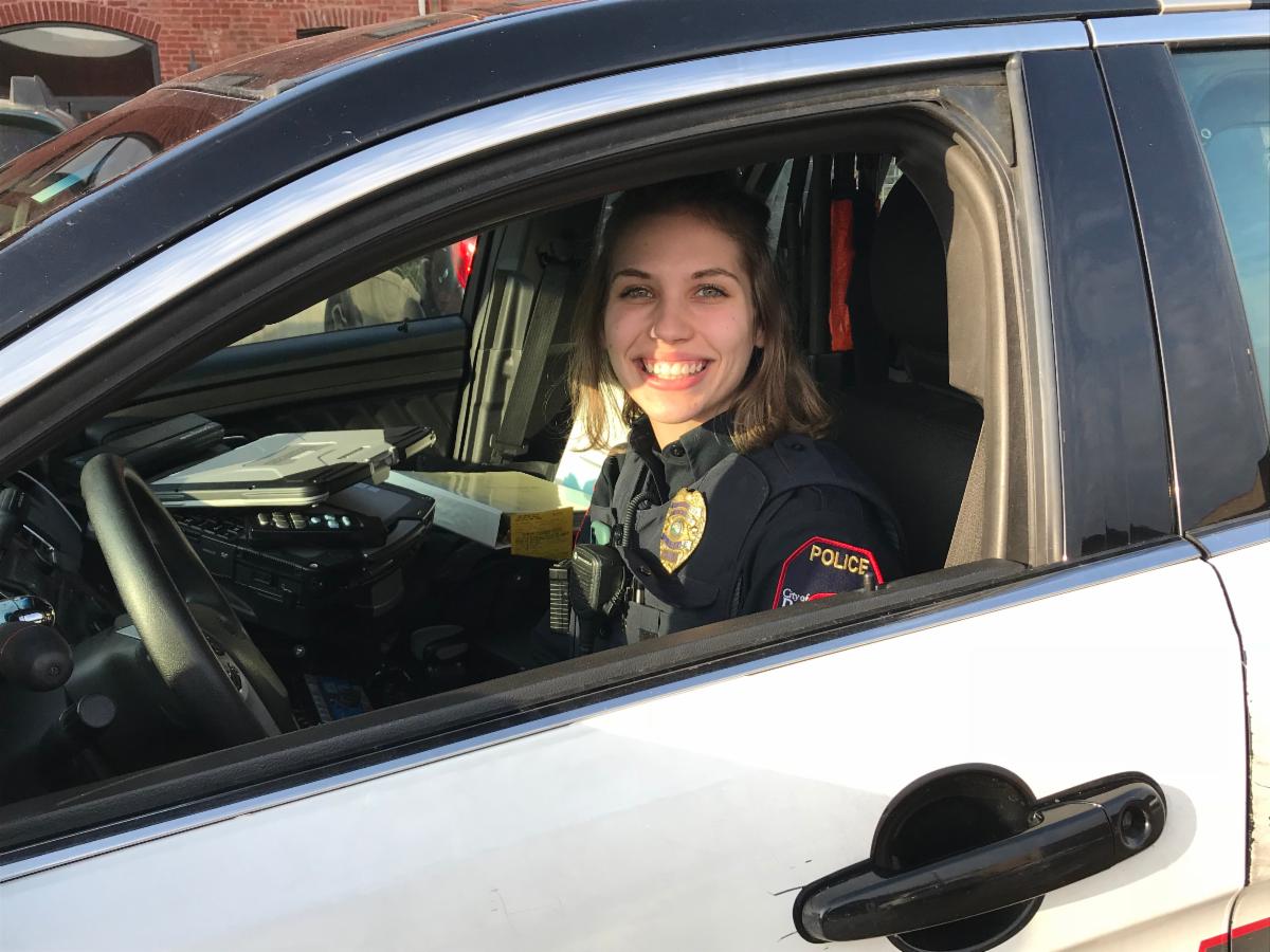 Photo of Officer Brittney Nielsen in a patrol squad