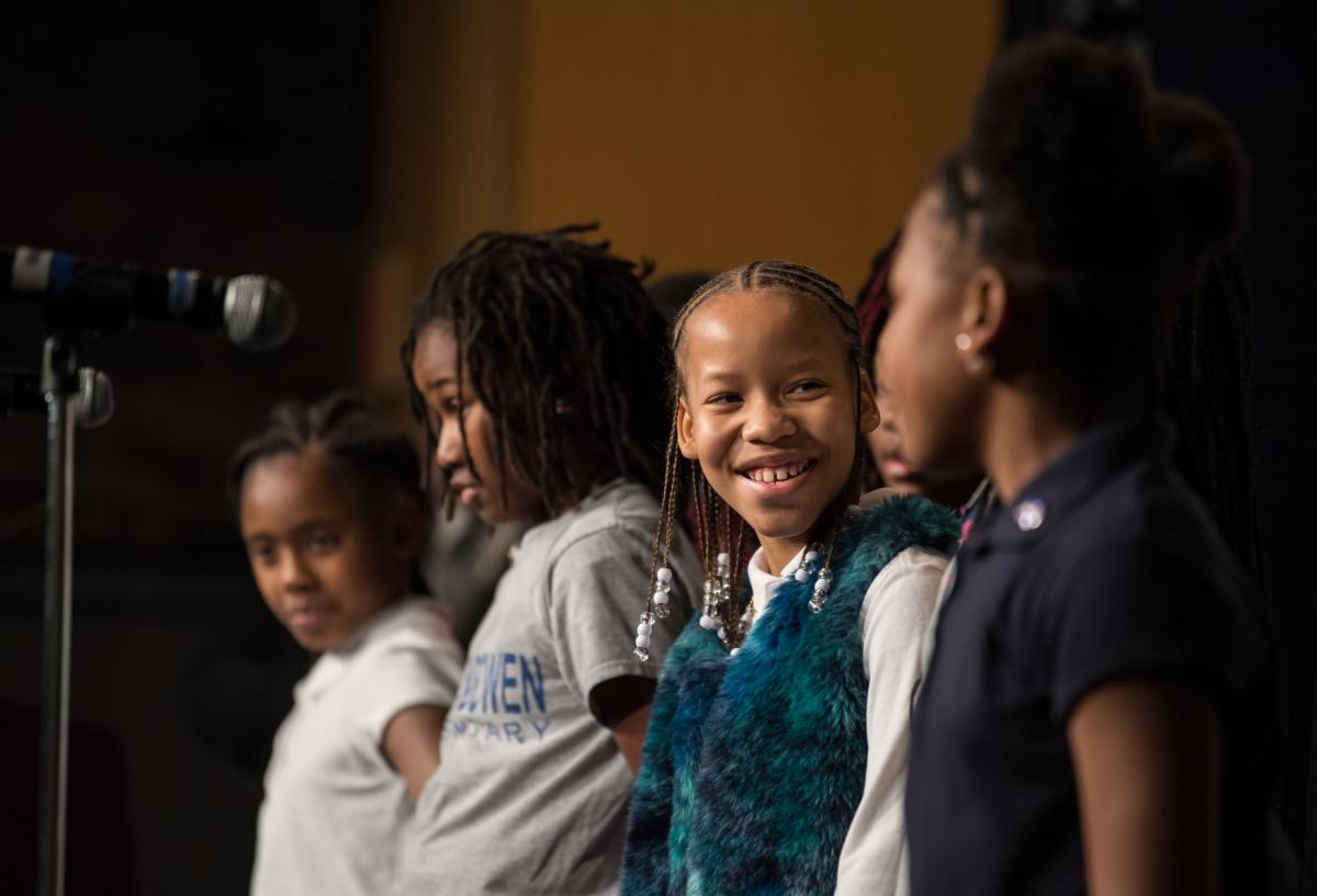 School-aged children in a choir perform at NASA Headquarters in Washington, DC.