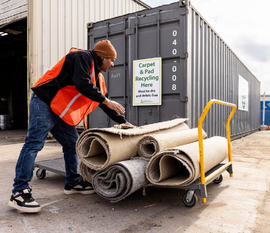 Taking carpet for recycling at a CARE drop-off site.