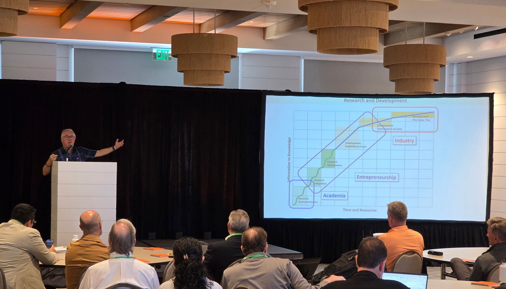 John Warner presenting