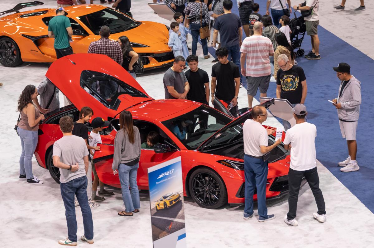 attendees around car at car show