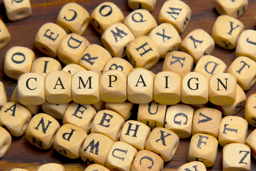 CAMPAIGN word written on wood block