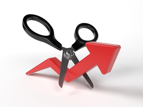 Red-colored finance arrow and scissors. On white-colored background. Horizontal composition with copy space. Isolated with clipping path. 3d render