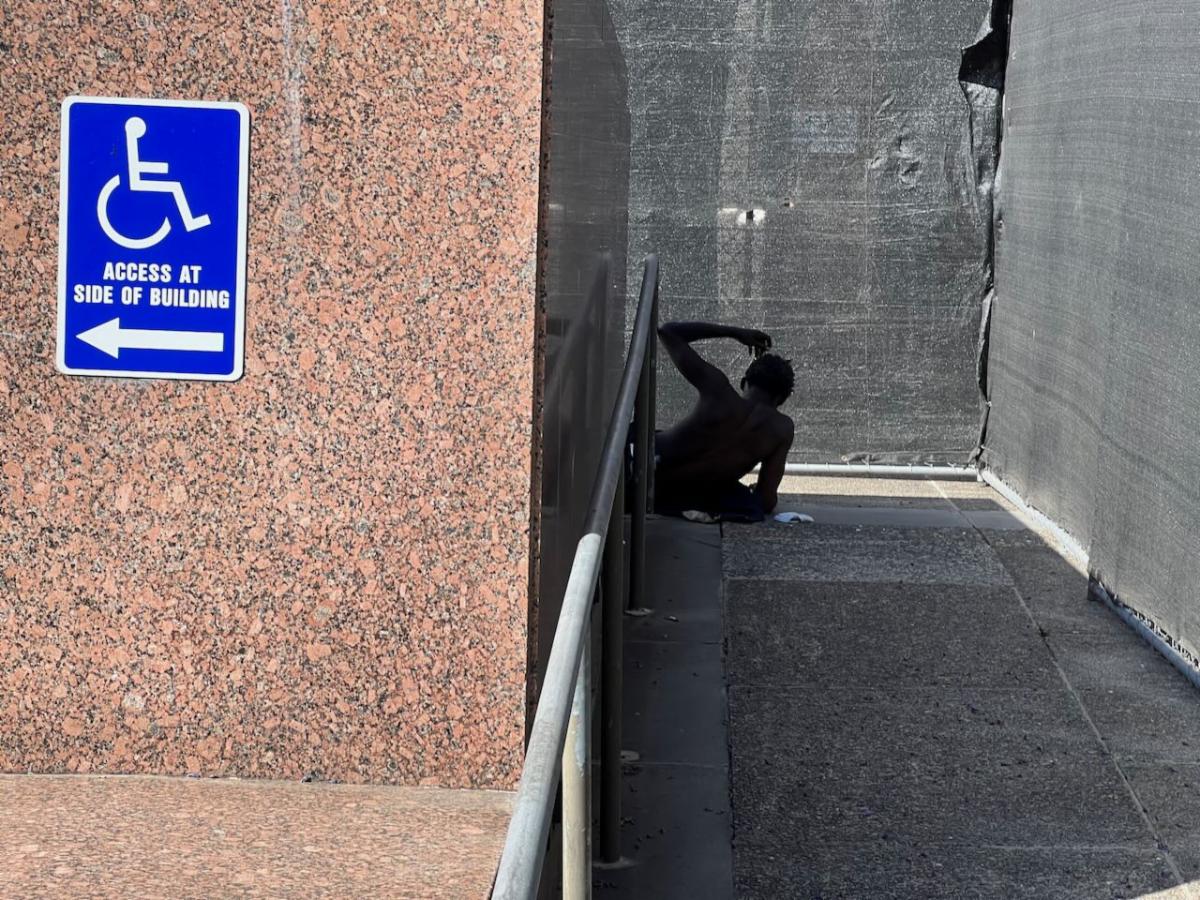 Homeless senior sleeps on the steps of the LA County Board of Supervisors Board Room