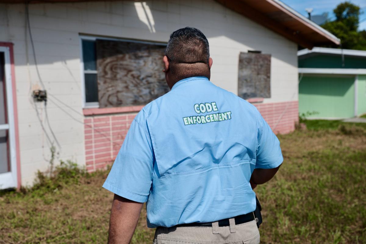 Code Enforcement inspecting a structure. 