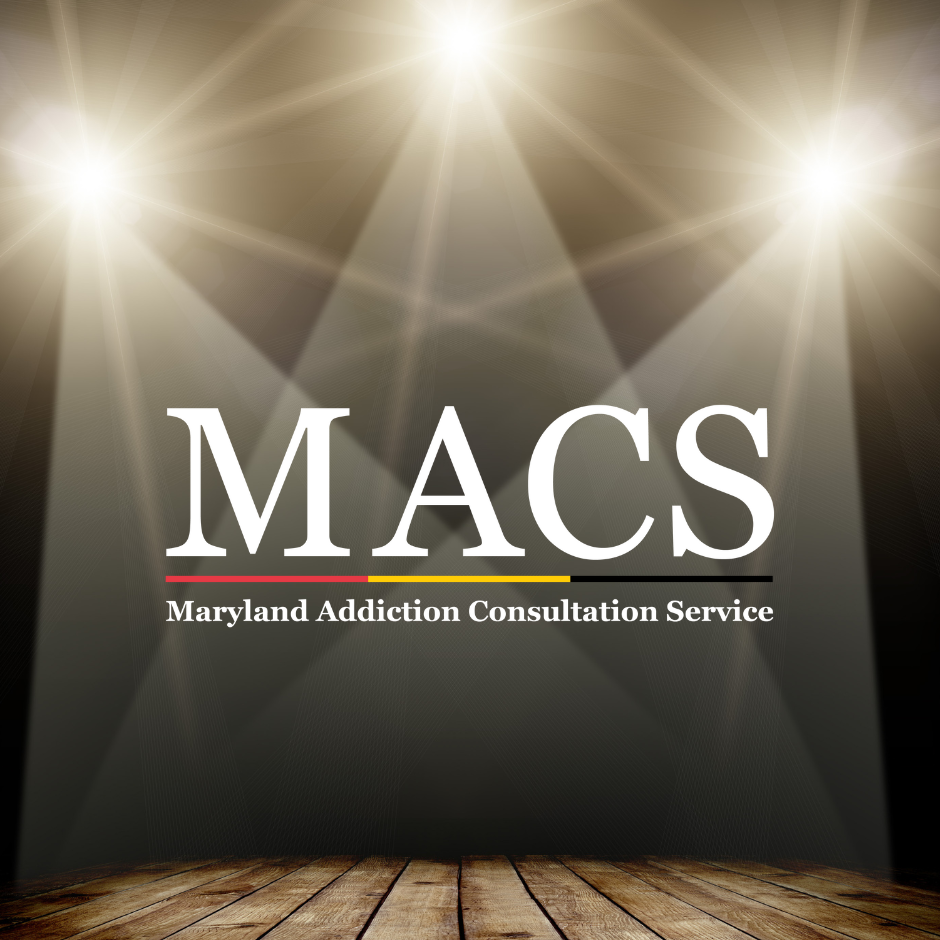 spotlights shining on macs logo