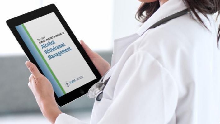 physician holding tablet