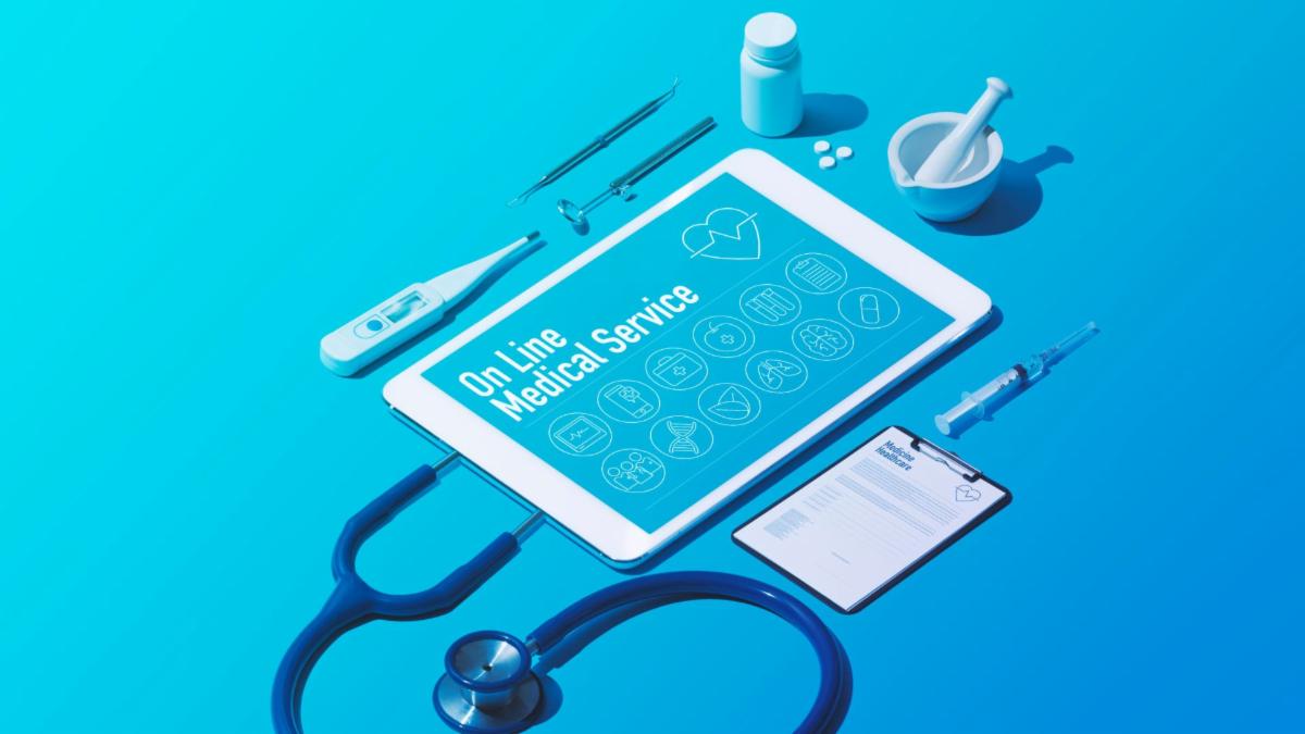 telehealth image with stethoscope tablet and other medical items