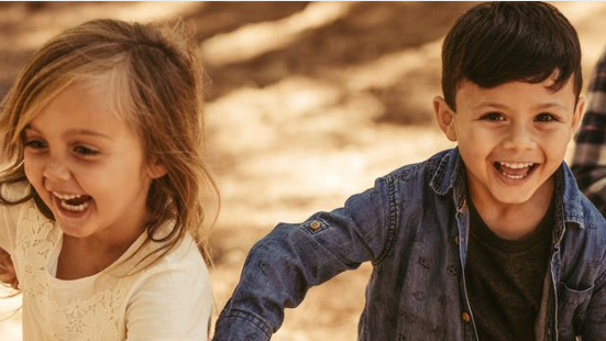 First responder vehicles on road with flashing lights at night