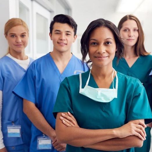 nurses in scrubs standing in formation