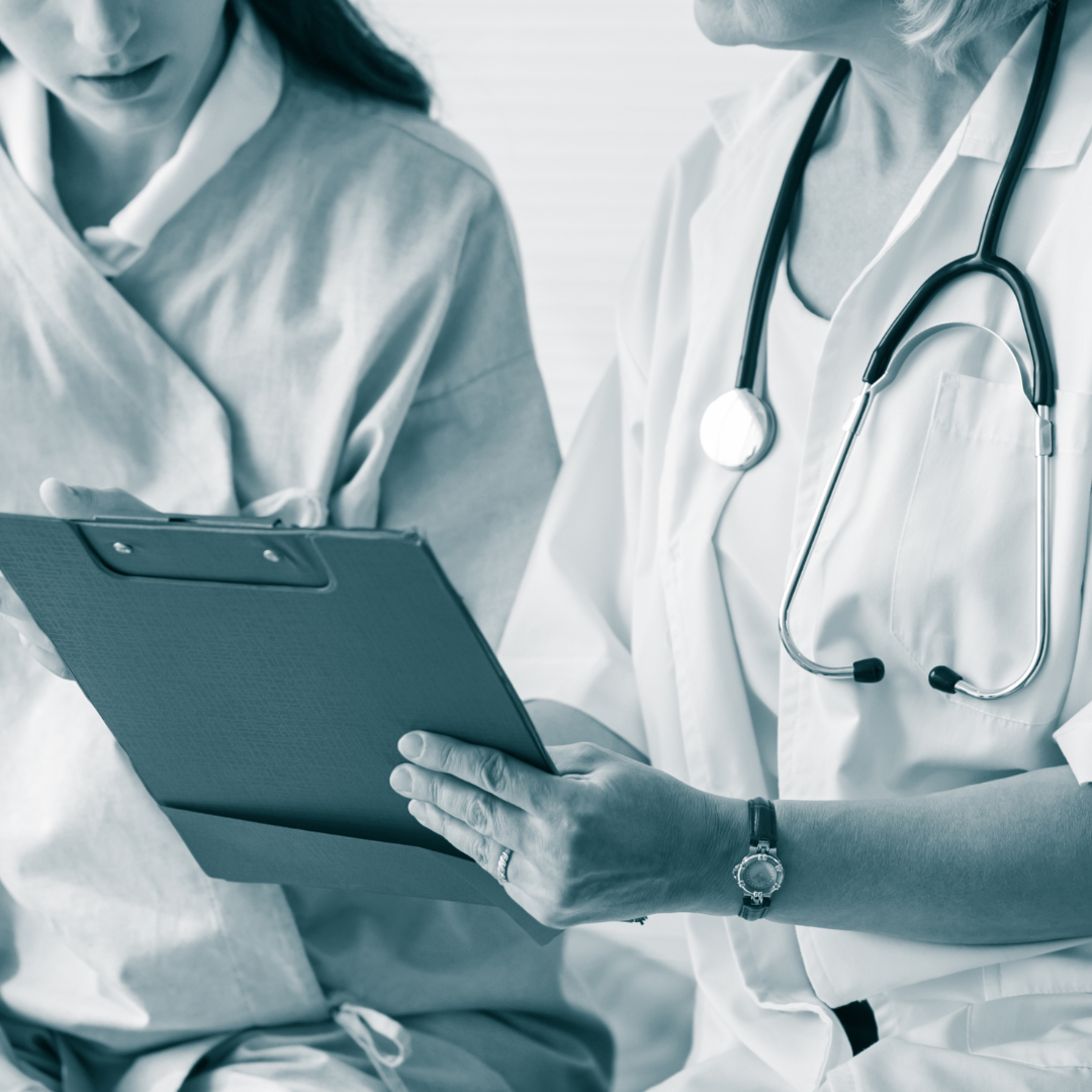 healthcare provider with patient holding clipboard