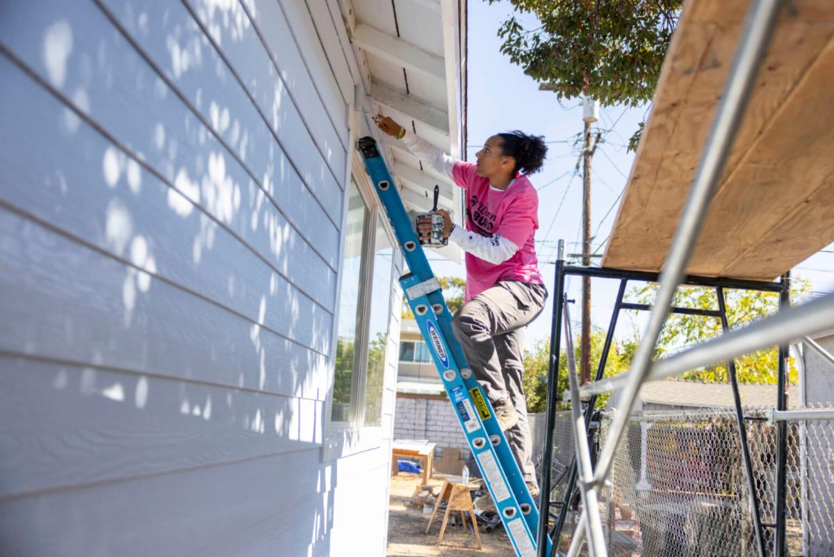 Cal State LA basketball senior Lily Buggs volunteers with Habitat for Humanity.