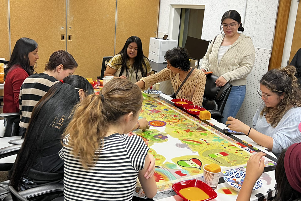 In celebration of Chicanx/Latinx Heritage Month, Cal State LA students from the Department of Communication Disorders and friends of the Robert L. Douglass Speech-Language Clinic participated in a collective painting experience inspired by Afro-Latinx music.