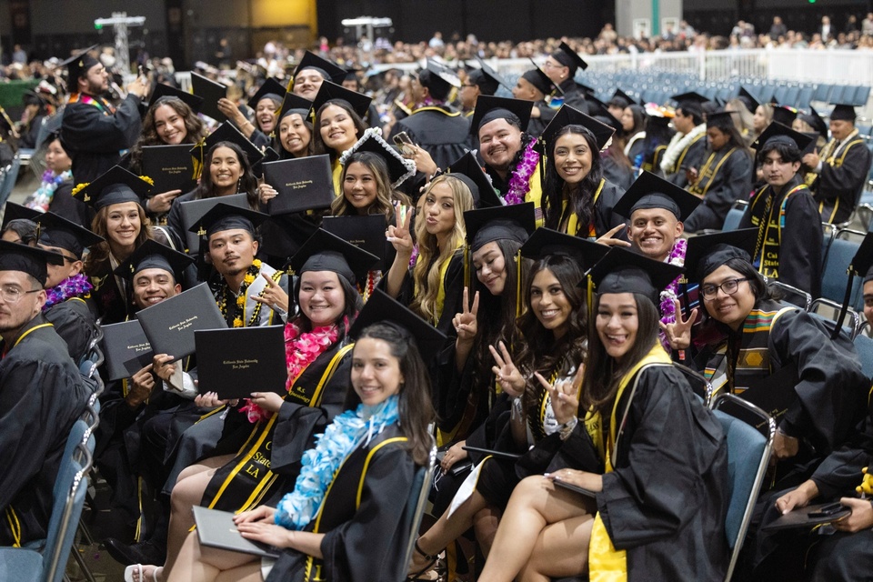 Photo: A group of graduating students in academic regalia during Commencement.