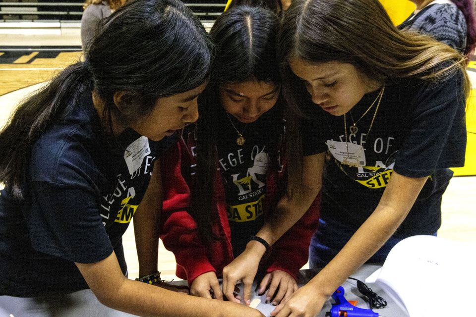 Alliance Richard Merkin Middle School students collaborate on their Jumping Robot project. 