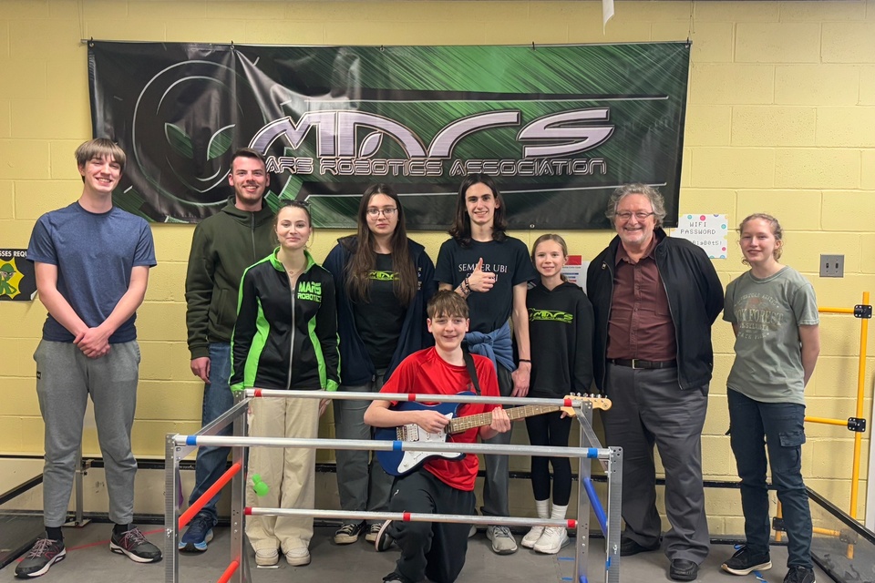 Photo: Students of the Mars Robotics Association, along with Cal State LA professor and composer John M. Kennedy (second from the right).