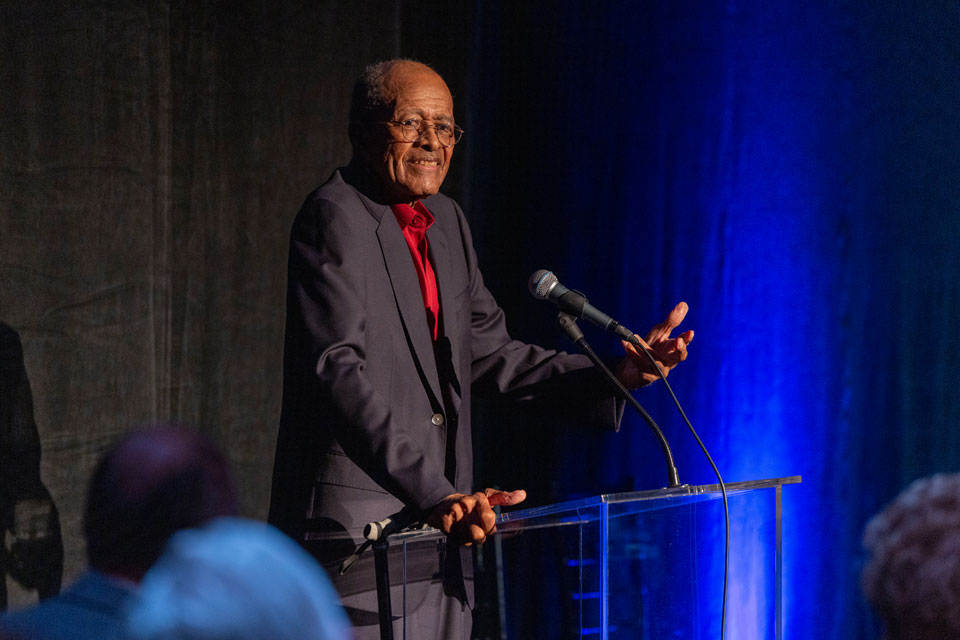 President Emeritus James M. Rosser speaking at a podium during the Luckman's 75th anniversary gala.