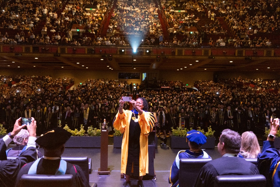 Photo: President Berenecea Johnson Eanes takes a selfie with the graduating class during the 2025 Cal State LA Commencement ceremony.