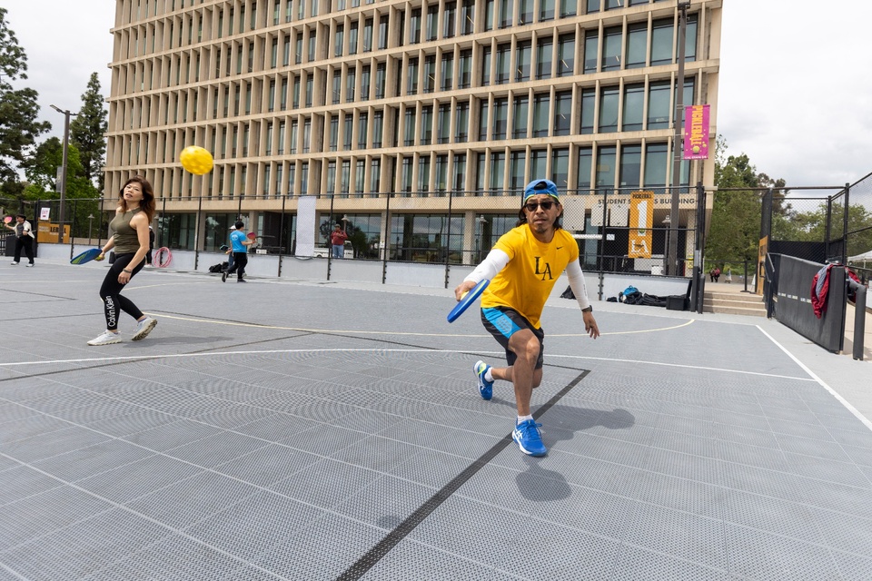 Photo: Two individuals playing on the Cal State LA's pickleball courts.