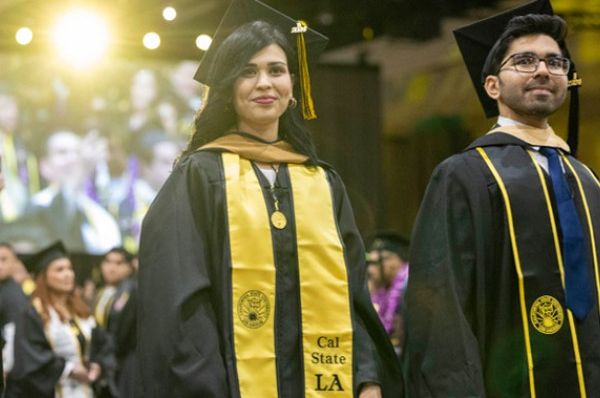 Graduating students in cap and gown at Commencement 2024.