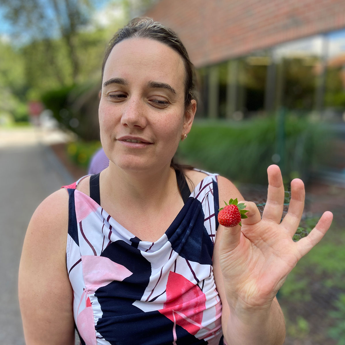 CHAI Works participant with strawberry