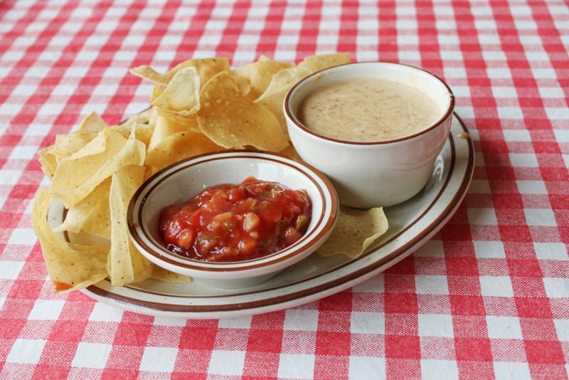 Chips and salsa on tablecloth