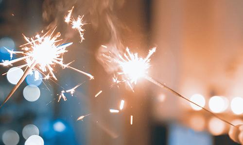 two sparklers light up a room