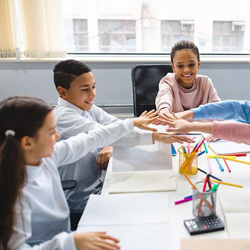 kids at a table working together