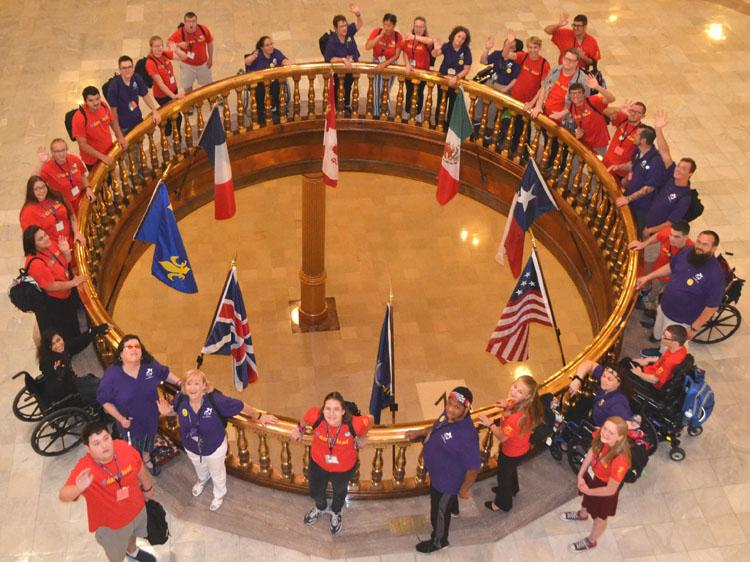 Delegates and volunteers look up as they gather in the State Capital Rotunda