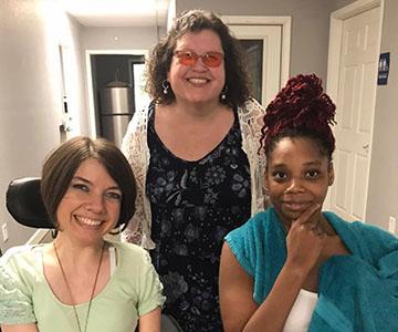 Carrie and Johnna take a photo with local youth Tyrhia after meeting with her about employment. All three ladies are smiling.