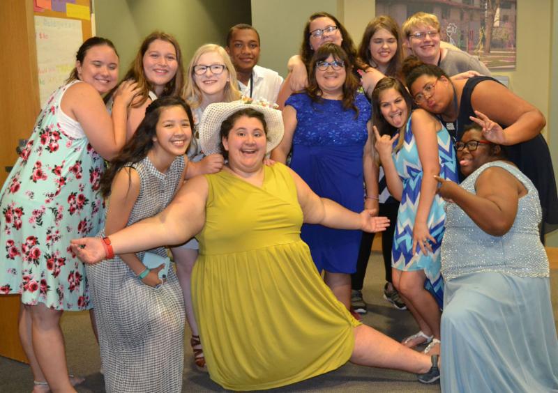 A group of delegates from the 2018 KSYLF smile and get close together for a photo after the dance