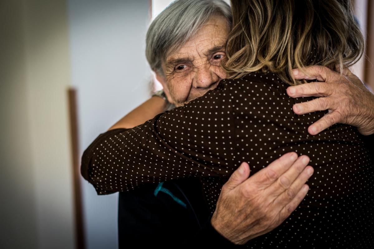 older person hugging their caregiver