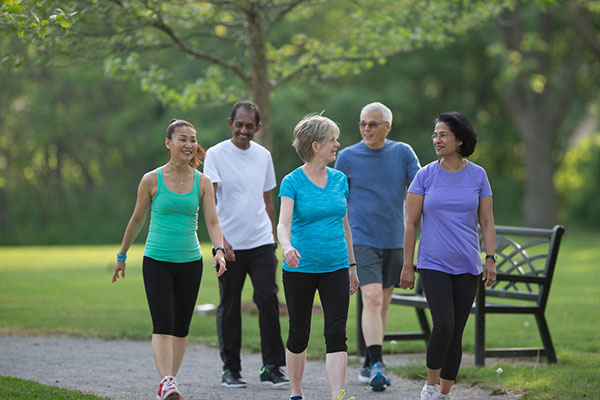 group of folks walking along a recreation path